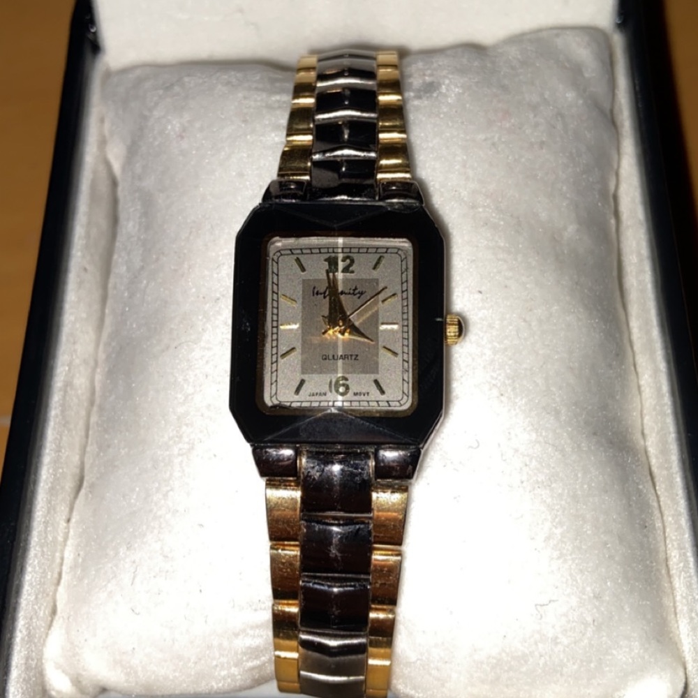 Kristine Black and Gold colored watch